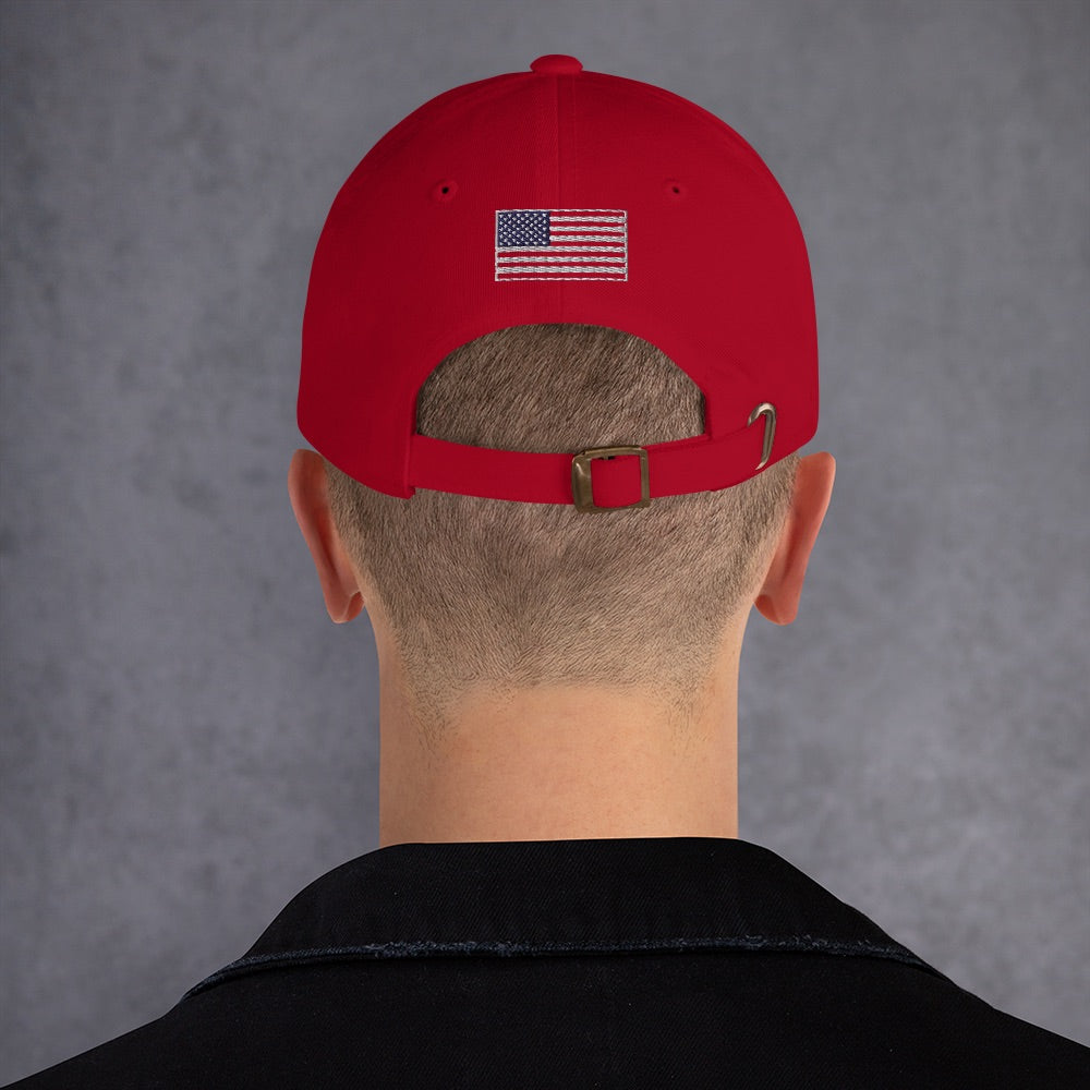 A side-profile view of the adjustable strap and unstructured design of the FOX One Nation baseball cap.