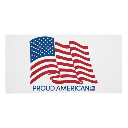 Close-up of the FOX News logo and Proud American text on the high-quality surface of a large computer desk pad.