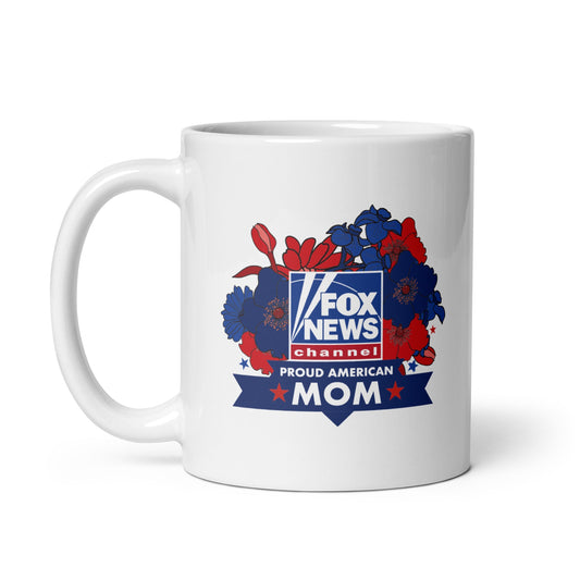 A clean, modern American kitchen setting featuring the FOX News Proud American Mom ceramic mug resting on a rustic wooden countertop.
